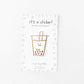 Gold foil sticker of a boba cup with a smiley face