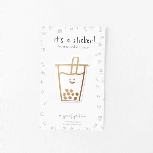 Gold foil sticker of a boba cup with a smiley face