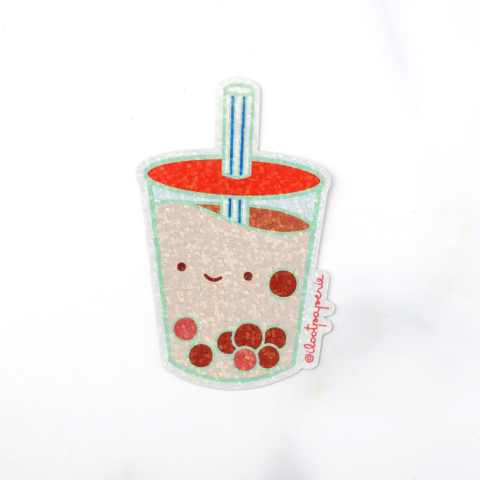 Glittery Boba sticker with blue stripped straw. Boba cup has a happy face on it.
