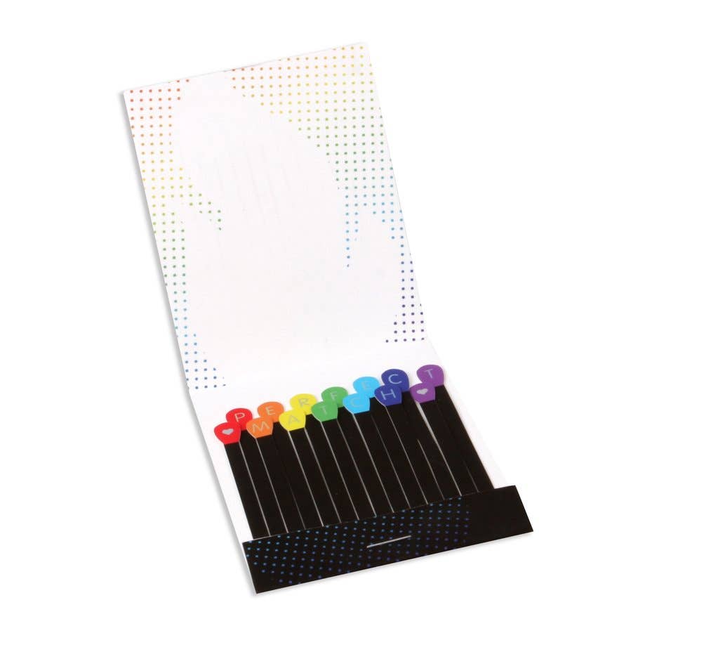 Photo showing inside of matchbook shaped greeting card. Card is black on the bottom with rainbow colored matches that spell out "Perfect Match" with hearts on either side. One letter per match, two matches with hearts.