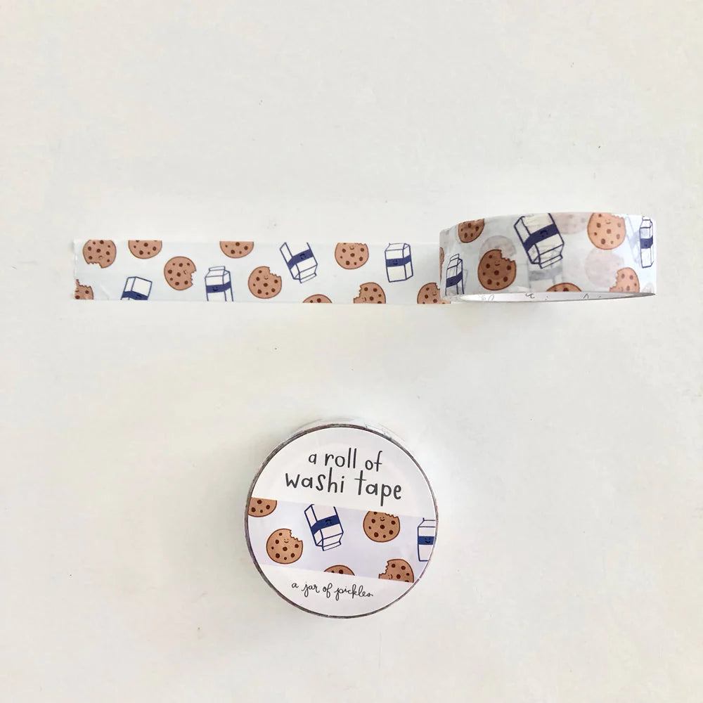 Unrolled washi tape with milk & cookies print. Below that is the front packaging of the rolled washi tape