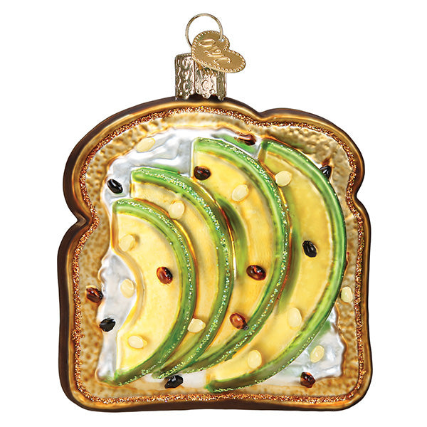 Avocado toast as a Christmas ornament; slice of bread with 4 slices of avocado on it 