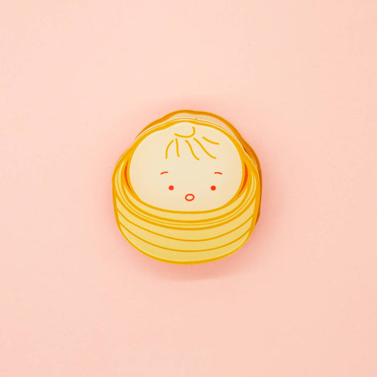 Single bao in a steamer. Acrylic clip.