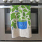 Basil plant dish towel by The Neighborgoods hanging on oven 
