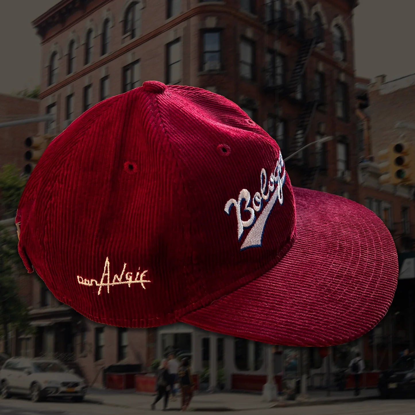 side of maroon corduroy cap -- has "Don Angie" embroidered on the side 