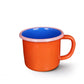 Mug made by fusing porcelain on to steel -- bottom portion + handle is coral, inside is electric blue and top rim is light pink. 