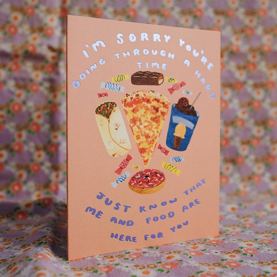 Card that reads: I'm sorry you're going through a hard time. Just know that me and food are here for you. Images of burrito, pizza, ice cream, candy, chocolate.