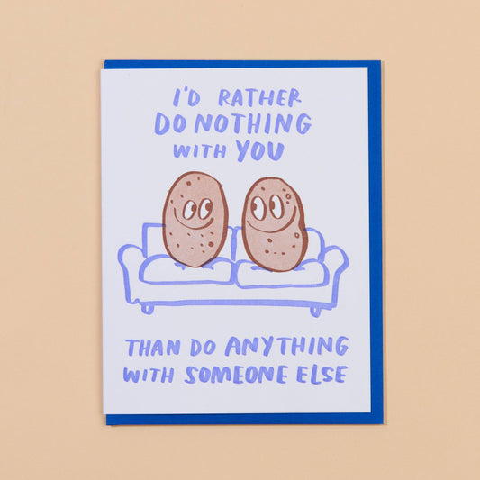 Greeting card that reads "I'd rather do nothing with you than do anything with someone else" with two potatoes on a couch