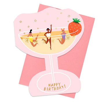 Another image of champagne birthday card along with a pink envelope. 