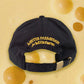Back embroidery of Gouda cap -- reads Mister Parmesan for Milkfarm in yellow 