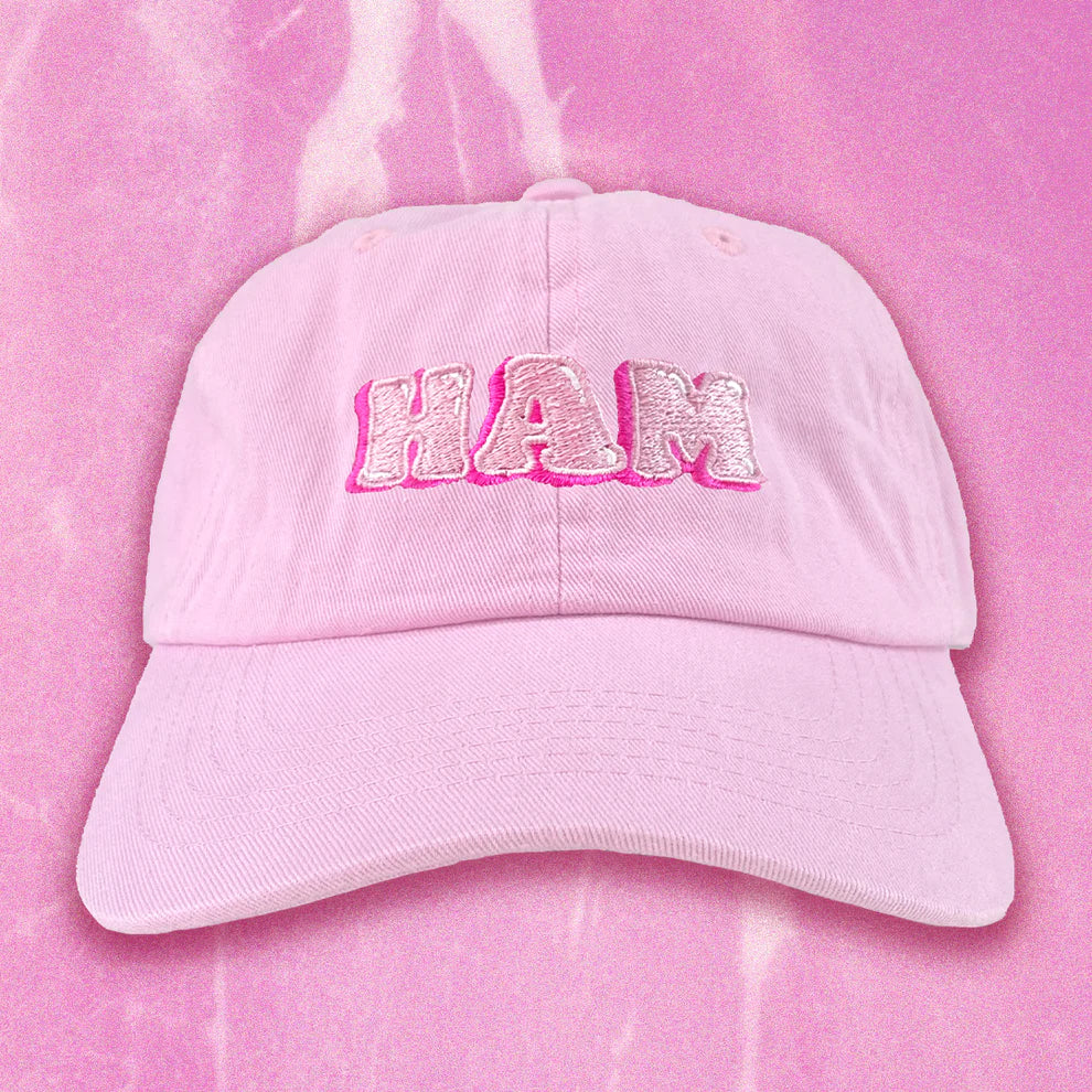 Pink cap -- a Mister Parmesan x Milkfarm collaboration -- has HAM embroidered on the front of two shades of pink 
