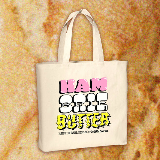 Canvas tote bag -- it has HAM, BRIE and BUTTER stacked on top of each other with Mister Parmesan for Milkfarm below it 