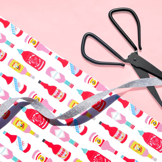wrapping paper that has different hot sauce bottles on it 