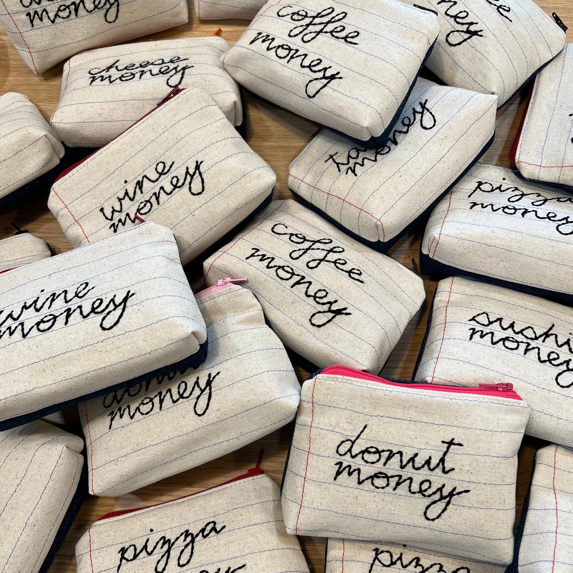 Zipper pouches -- hand sewn design made to look like lined paper. Each one says something different -- donut money, cheese money, wine money, coffee money, sushi money, boba money, pizza money 