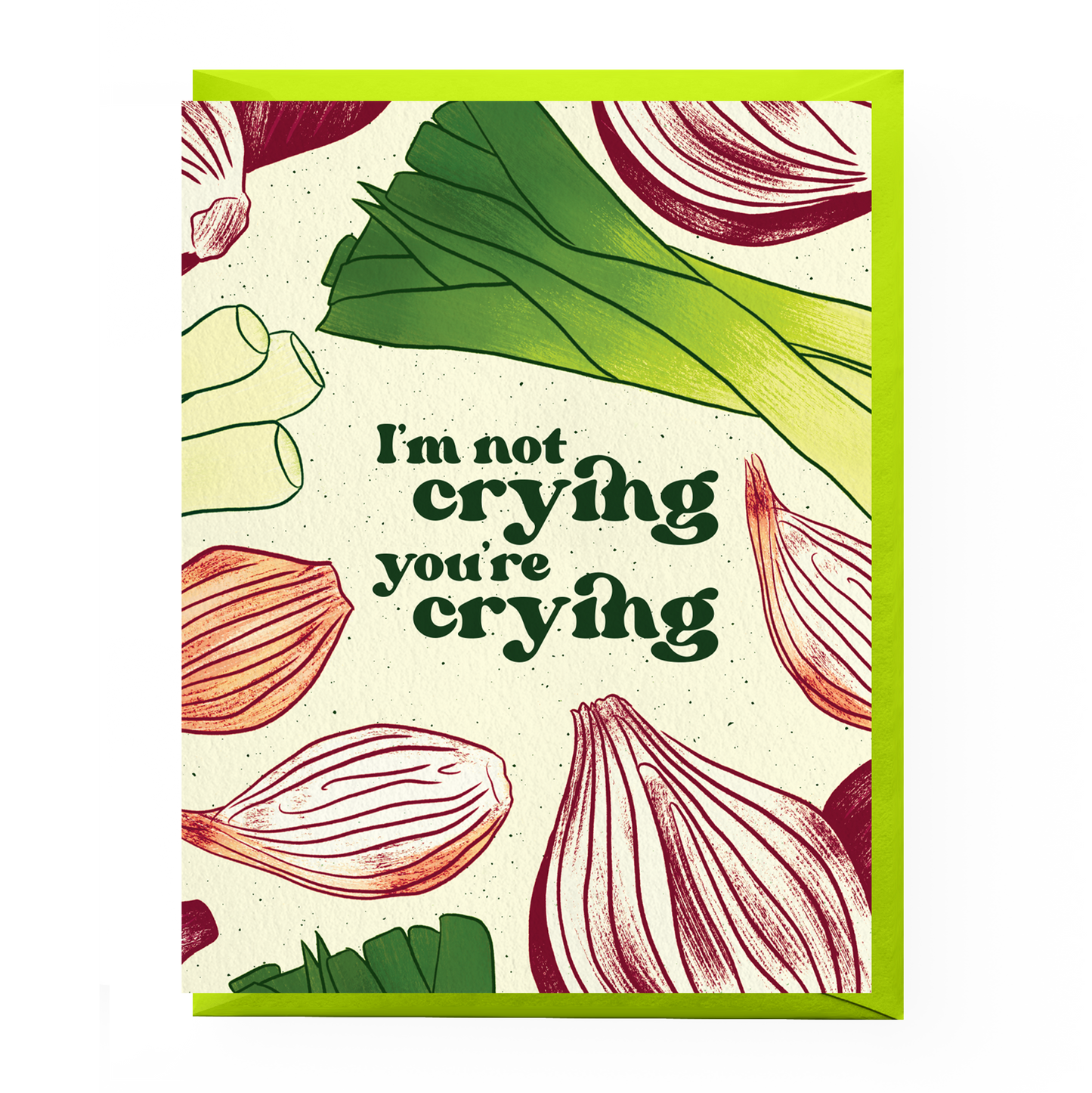 White greeting card that has leeks, green onions, shallots and red onions all over. In the middle it reads "I"m not crying you're crying" Comes with a yellow green envelope. 