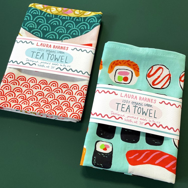 Bowl of Ramen tea/kitchen towel and sushi cotton tea/kitchen towel in packaging 