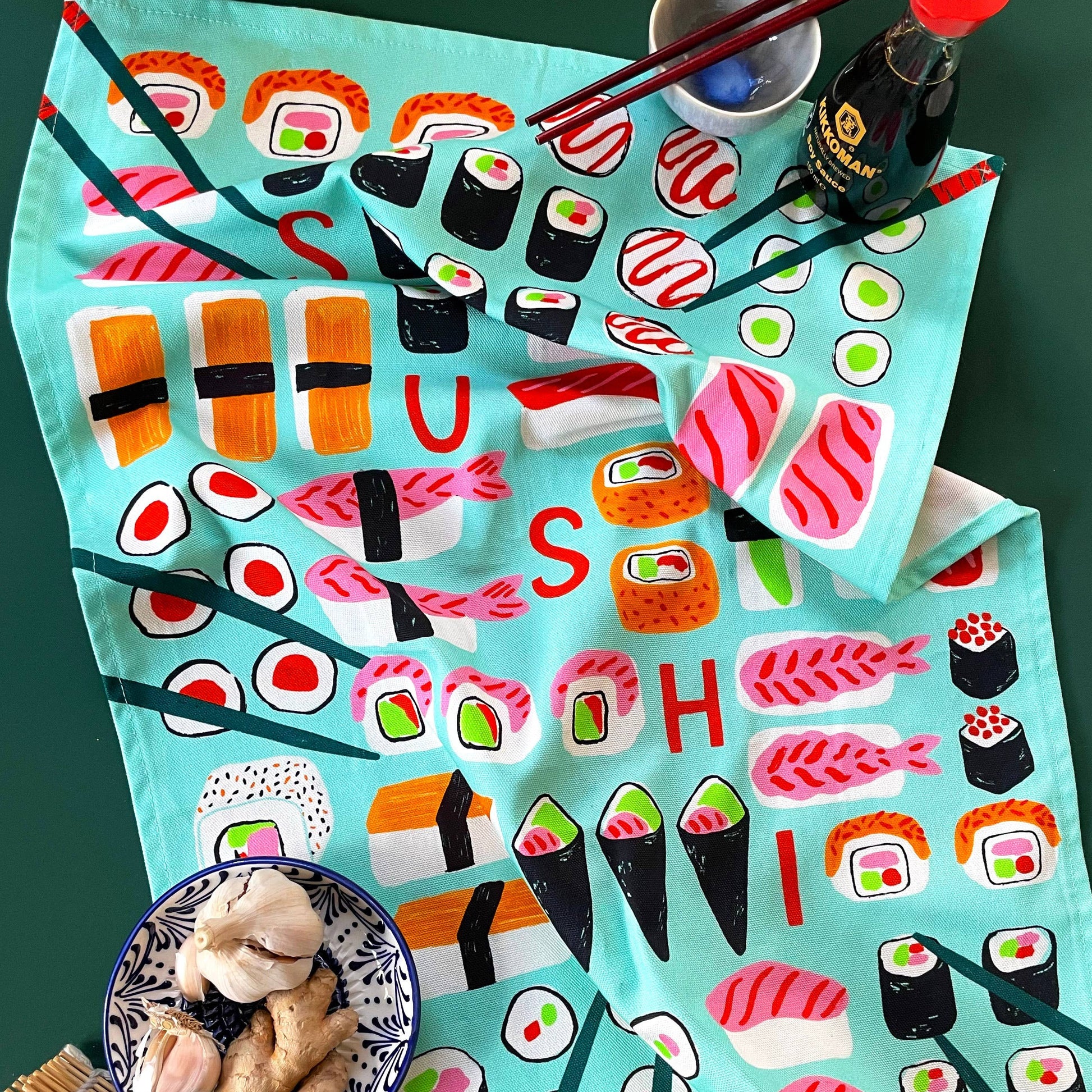 organic cotton tea towel with different sushi on it 