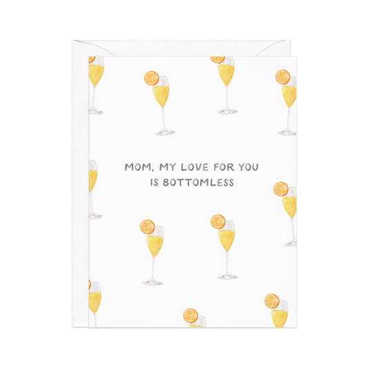 Greeting card with mimosa pattern. The card says "mom, my love for you is bottomless."