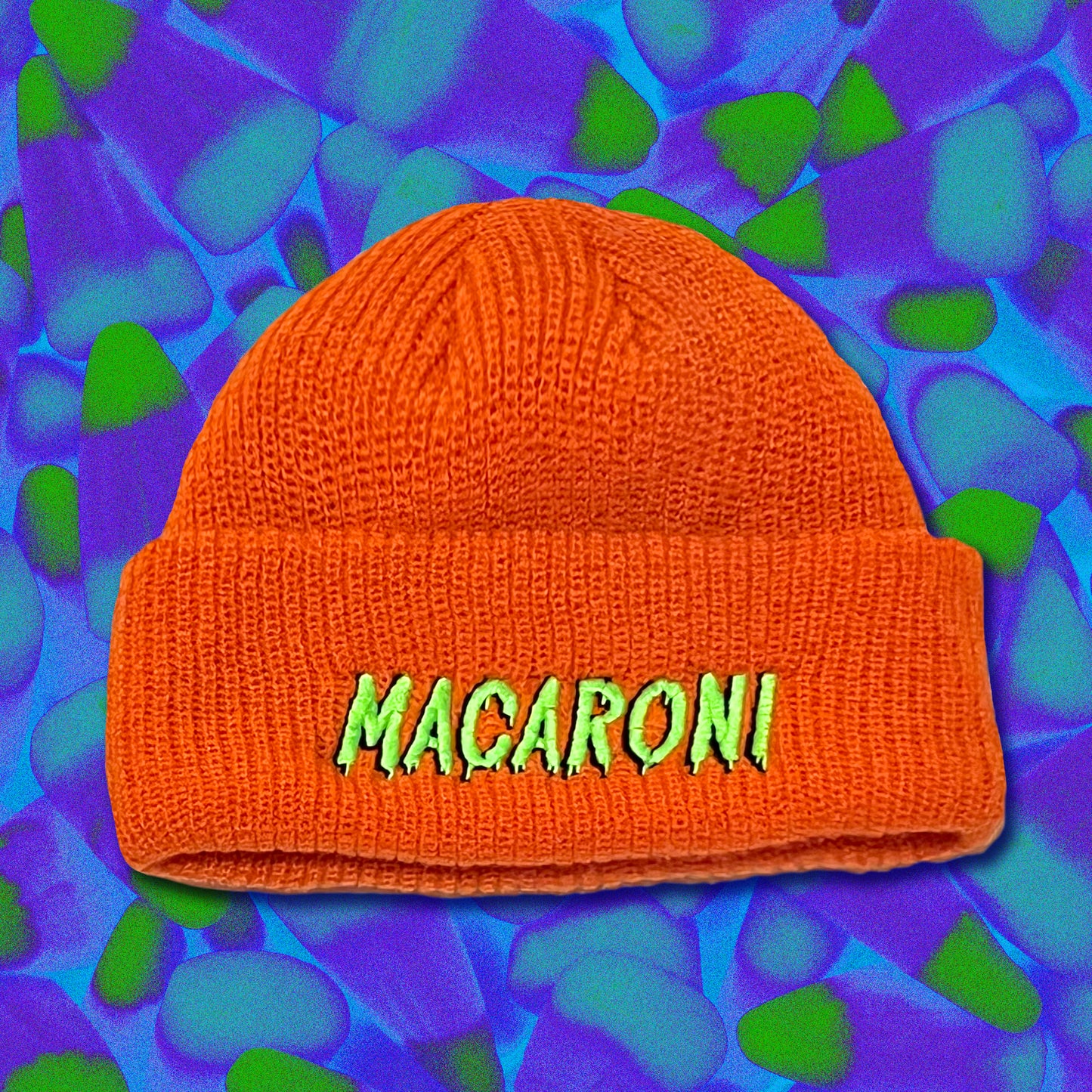 Orange watch cap with MACARONI embroidered on the front in lime green 