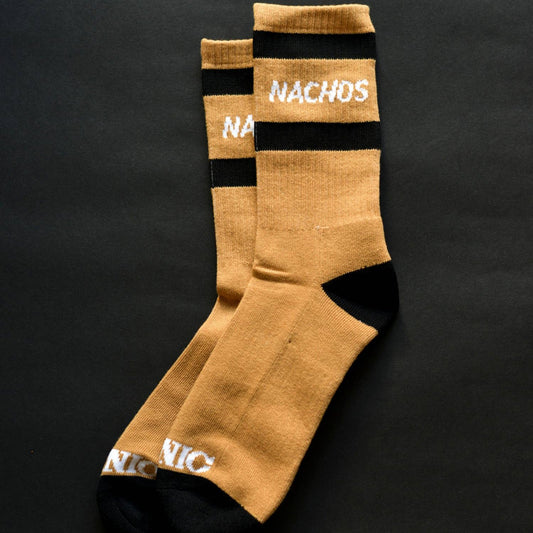 Socks. NACHOS written between two black lines in white words. Black fabric on the heal and toe. 