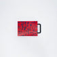 Small red w/blue confetti cutting board w/black handle