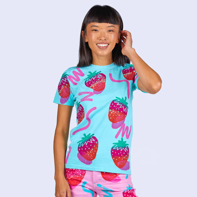 Aqua blue t-shirt with snazzy strawberries and squiggly lines on it 