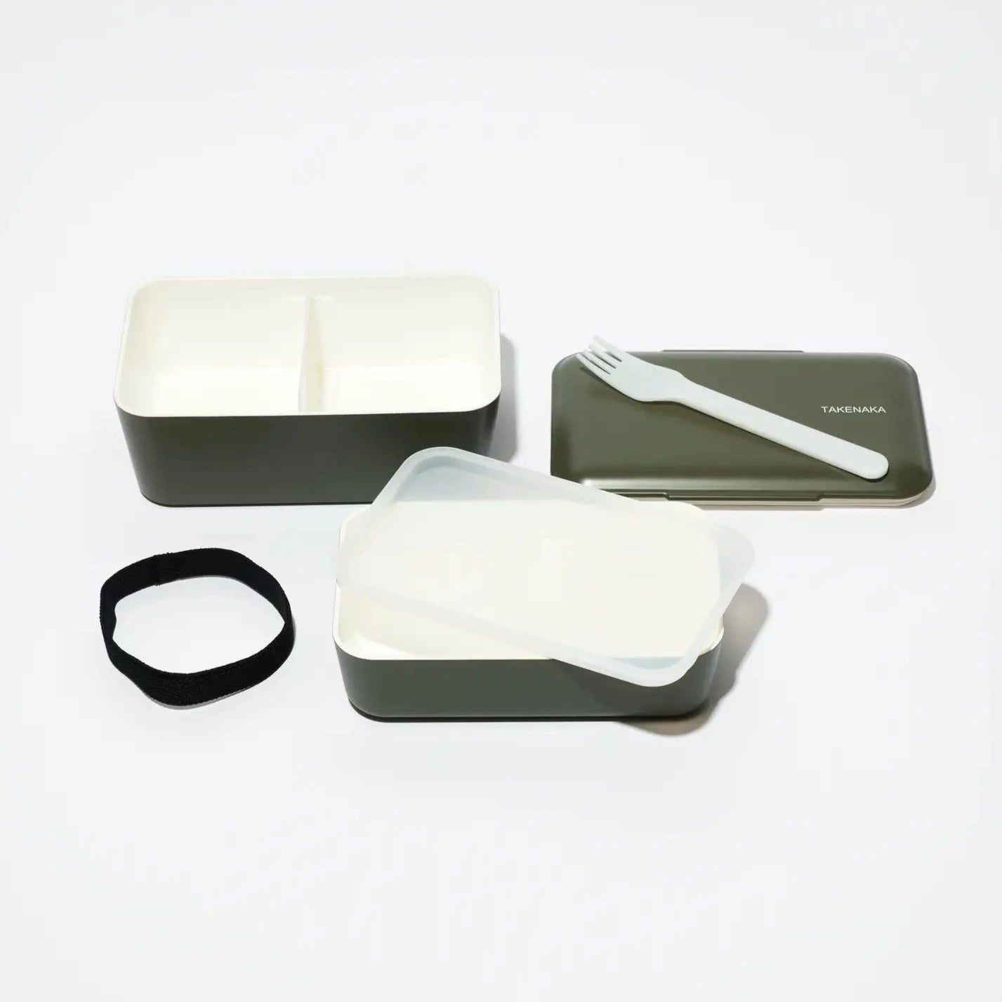 Dual Bento Box separated into sections -- bottom compartment with fork, top compartment with center divider, elastic band to hold it all together 