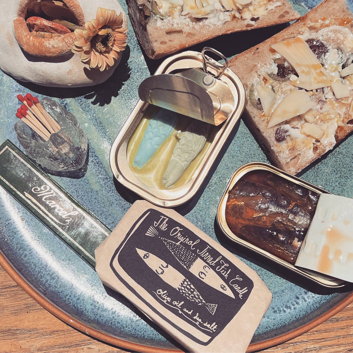 Flat lay of tinned fish candle -- comes packaged like real tinned fish 