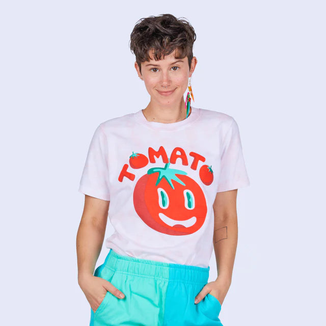 white tee that reads "tomato" above a red tomato with a face