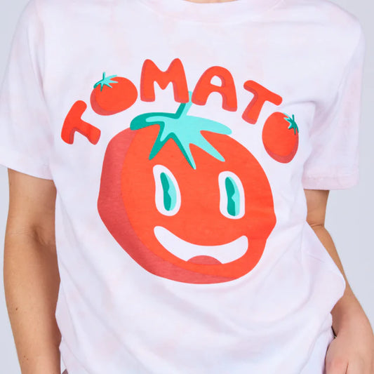 white tee that reads "tomato" above a red tomato with a face