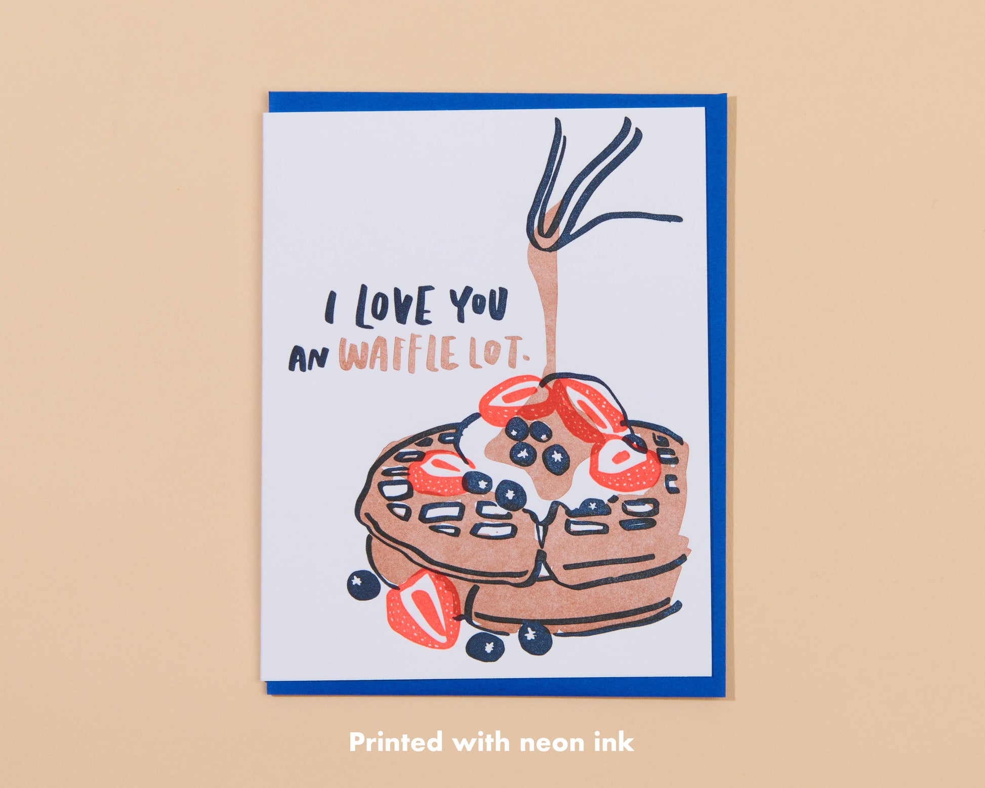 Greeting card that reads "I love you an waffle lot" and has an image of a waffle with berries, cream and syrup