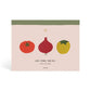 Front cover of Vegetable Medley Meal Planner. Features illustration of tomato, red onion and yellow apple on neutral background with rustic green stripe along the spine. Cover text reads "ON THE MENU... meal planner"