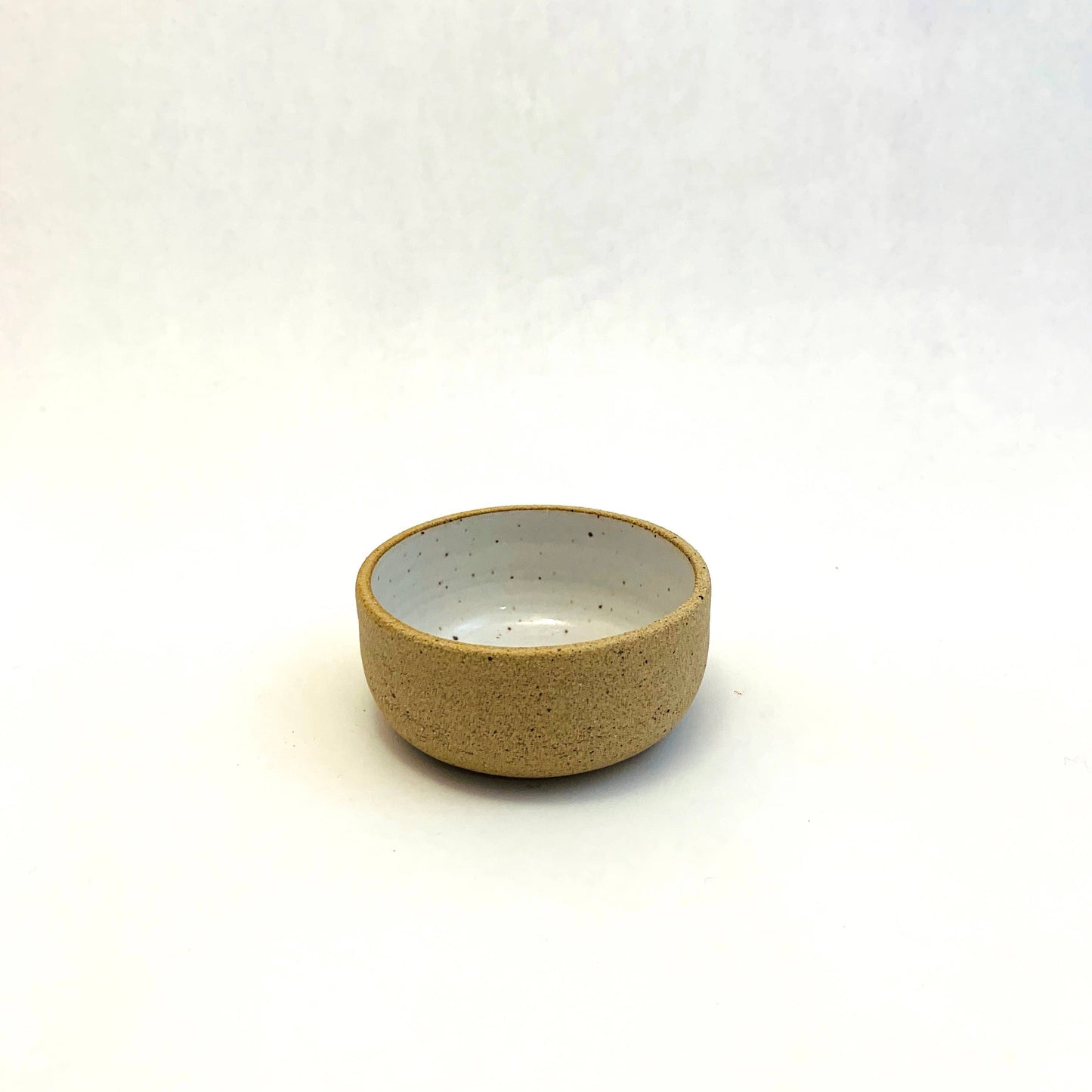 mini ceramic bowl -- glazed white inside and left unglazed outside 