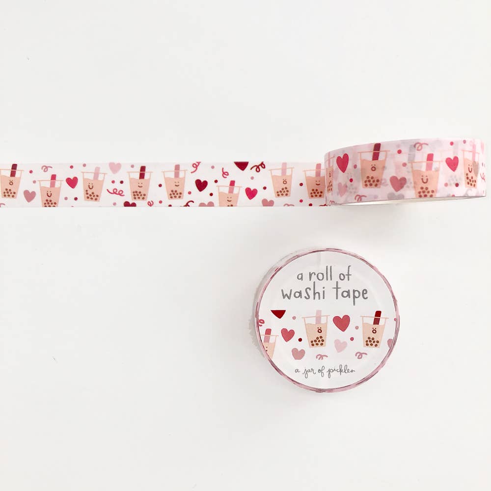 Photo of washi tape with smiley boba drinks and pink and red hearts.