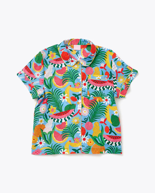short sleeve, button down and collared leisure top. Has a pocket on the left chest area. Rotary print is primarily blue with various florals, foliage and fruits. 