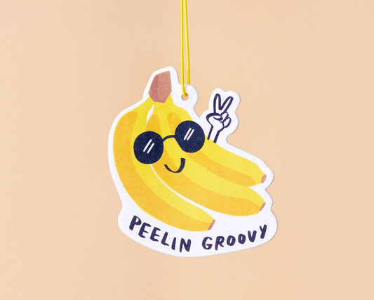 bunch of bananas air freshener with sunglasses on and text below that reads "Peelin Groovy" - banana scented 