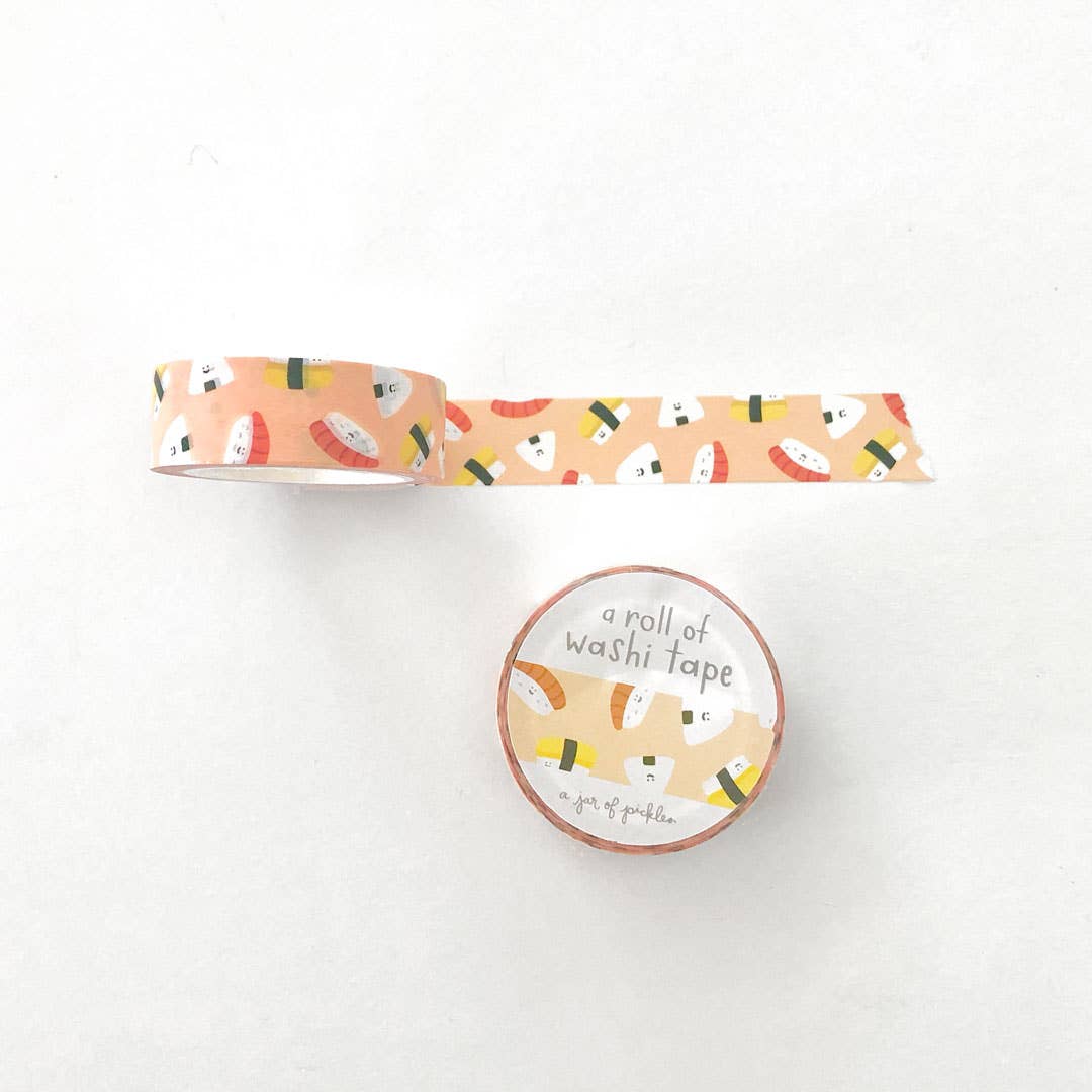 Unrolled washi tape with various sushi as the print, below it shows the front packaging of the roll