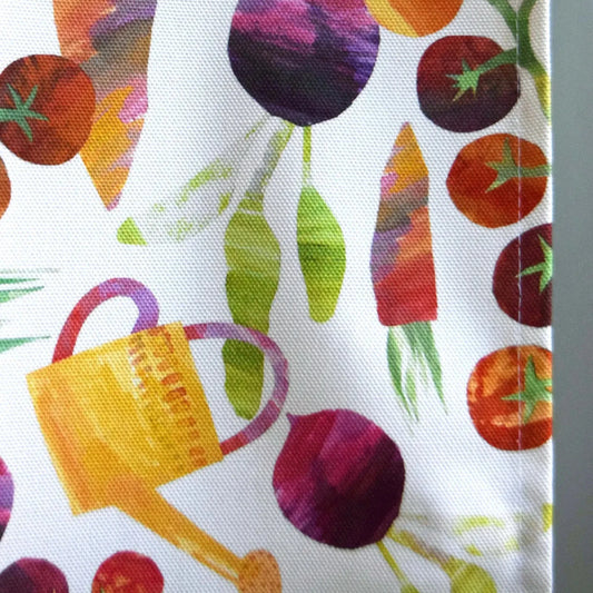 close up of the garden veggies and watering can design 