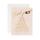 Greeting card with illustration of a bottle of champagne being poured over a tower of champagne glasses. Text reads "Cheers!" in metallic gold script.