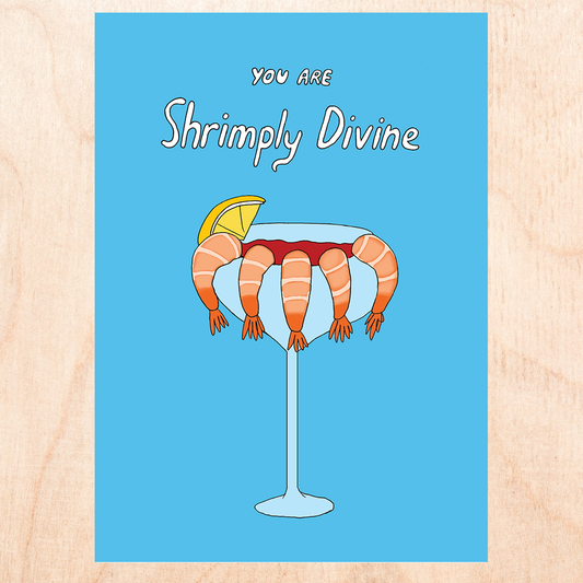 Sky blue greeting card with shrimp cocktail on it and text above that reads "You are shrimply divine" 