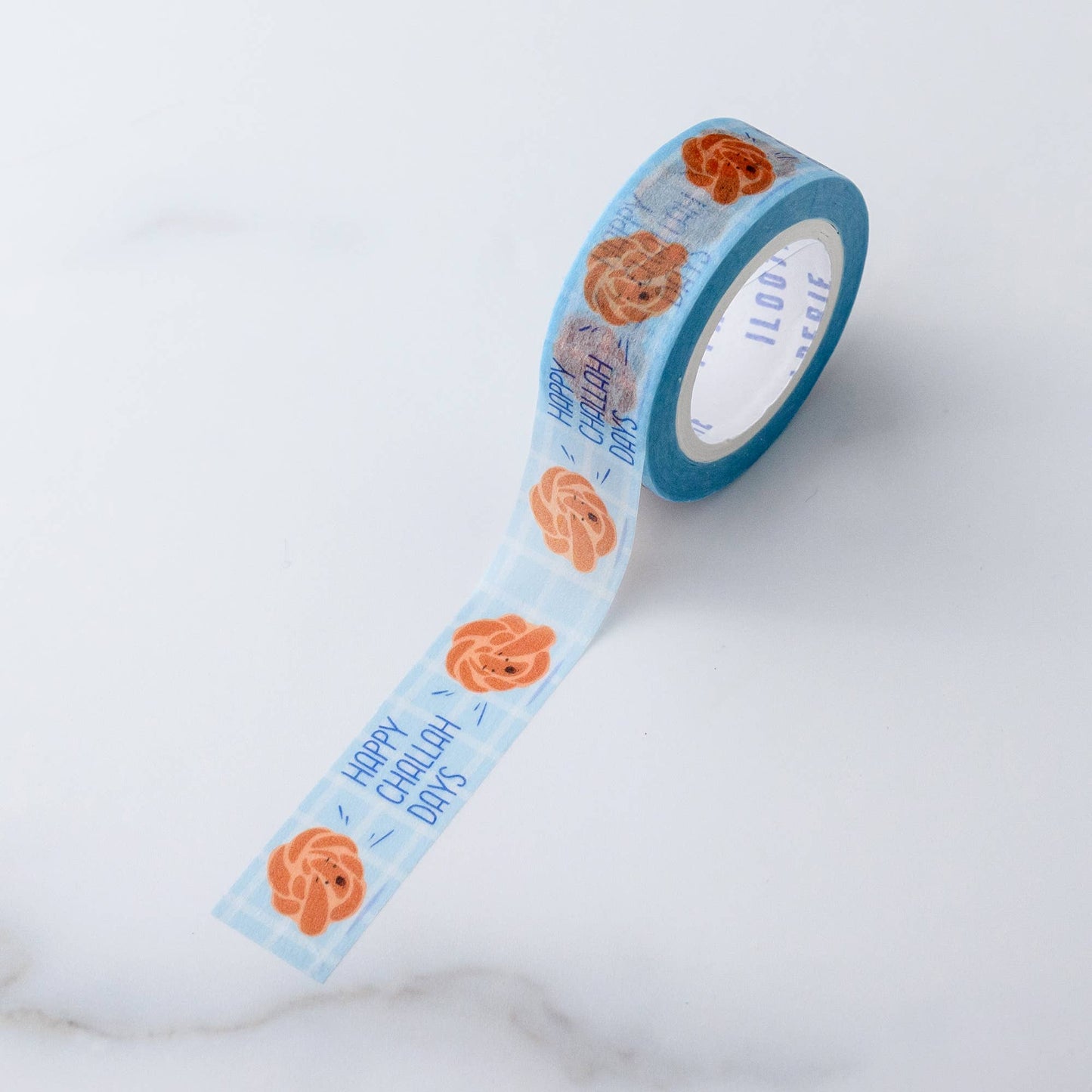Challah washi tape roll -- has illustrated challah bread on it and they're saying "Happy Challah Days" 
