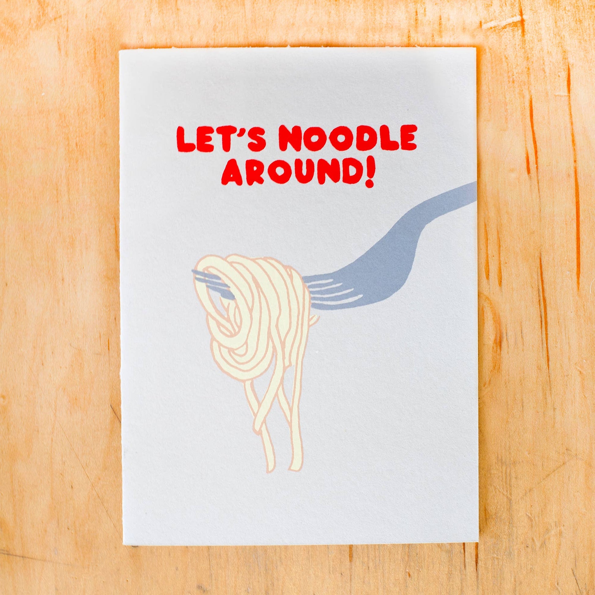 Greeting card that reads "Let's noodle around!" and has an image of a fork with noodles on it 