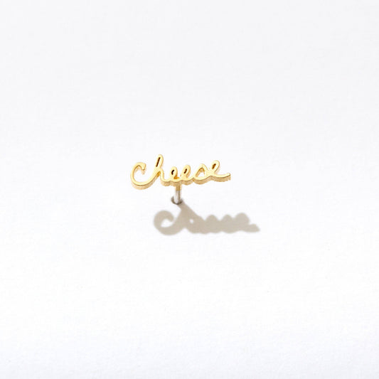 Single 14k gold plated stud earring -- reads "cheese" in handwritten script