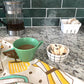 Coffee Dish Towel by The Neighborgoods on kitchen counter 