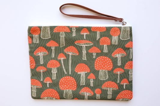 Wristlet zippered pouch with mushrooms on it 