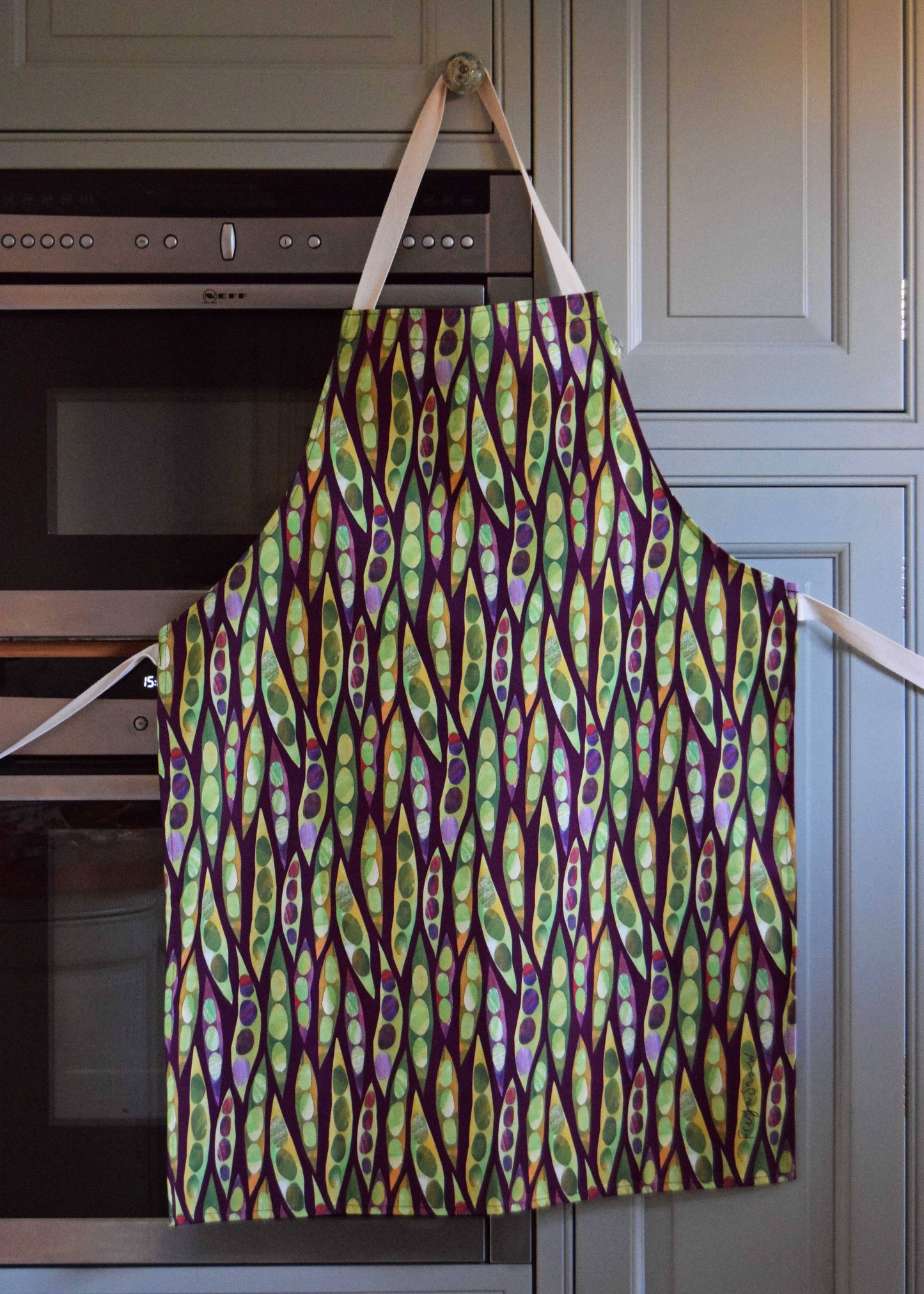 Adult size apron with runner beans as the overall print 