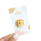Handmade magnet shaped like stack of five pancakes with syrup and butter on top. 