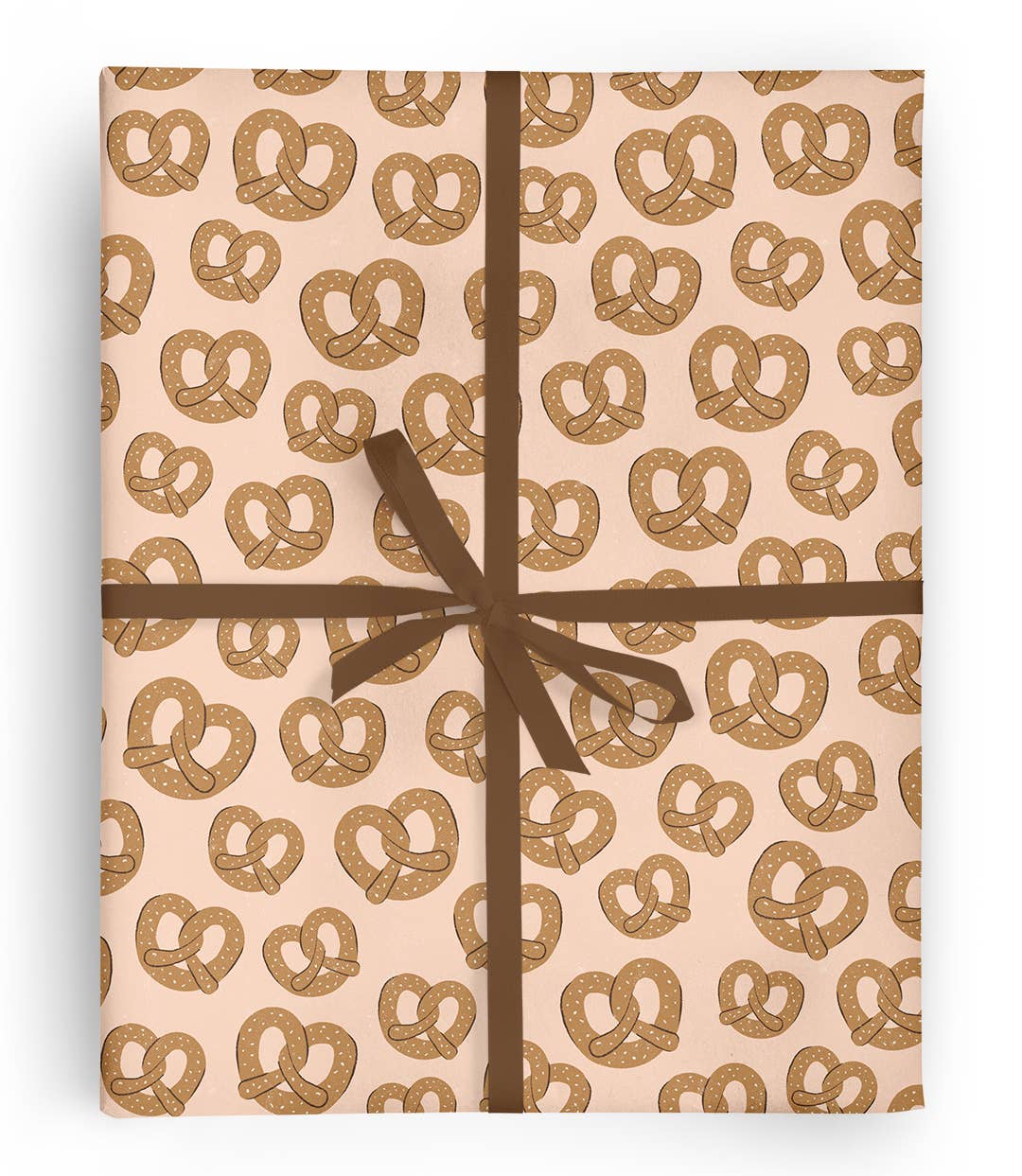 Sheet of gift wrap with salted soft pretzels on it 