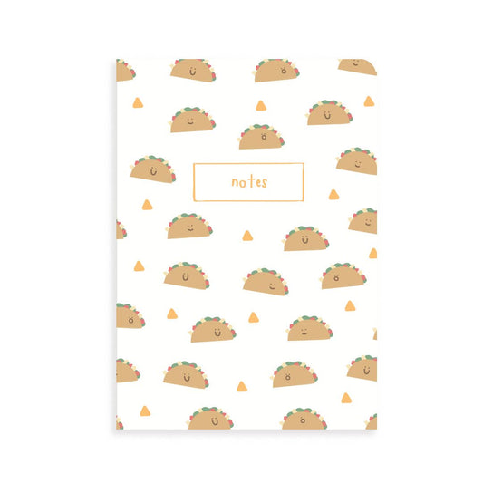 front cover of notebook has smiley tacos and tortilla chips all over. Top middle has a box outlined in yellow that has "notes" written inside.  
