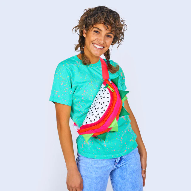 dragonfruit fanny pack worn as cross body on model 